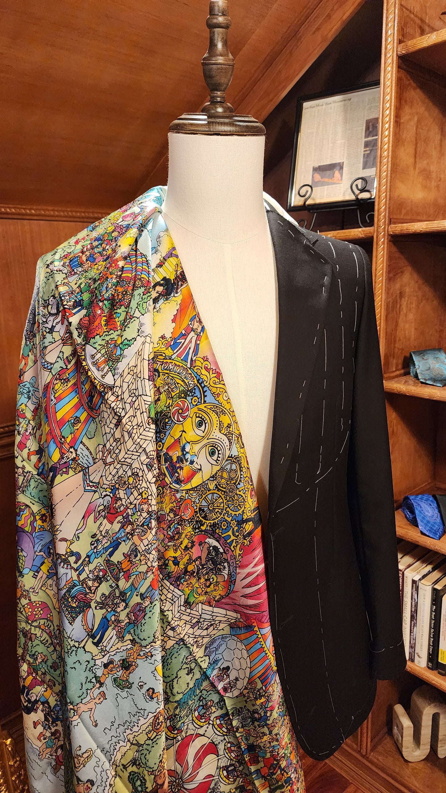 Unique custom art suit lining in front of a area made of wood.
