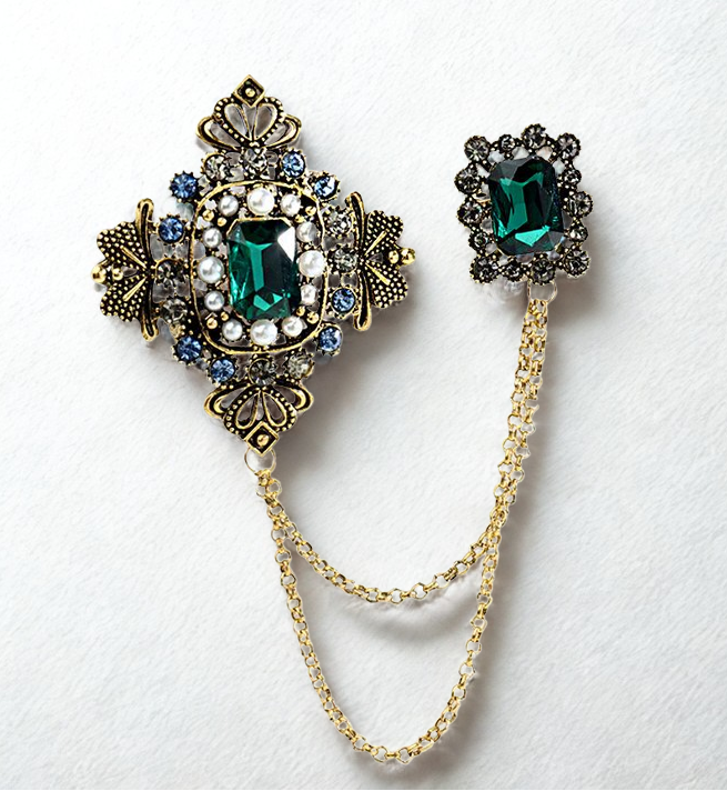 Jewelry set with brooch and matching earring on a white background