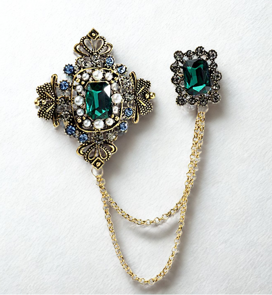 Jewelry set with brooch and matching earring on a white background