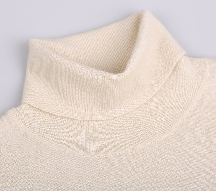 Close-up of a beige turtleneck sweater on a light gray background