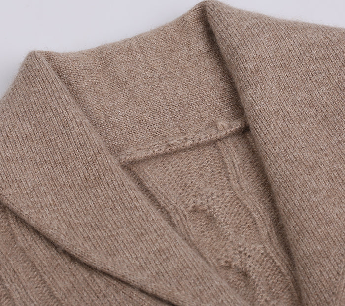 Close-up of a brown cardigan with a white background