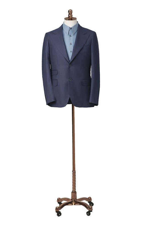 Blue suit jacket on a mannequin with a white background
