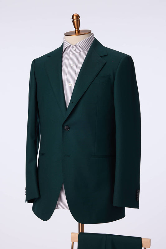 Green suit jacket on a mannequin against a white background