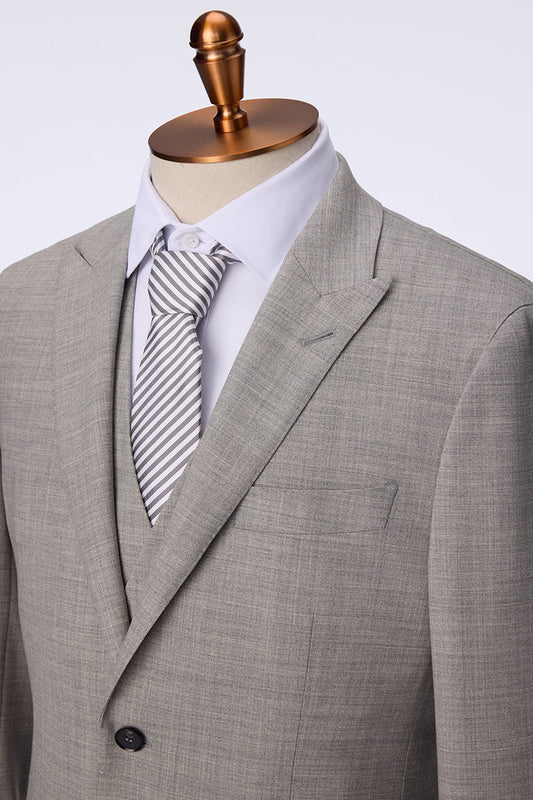 Gray suit with a striped tie on a mannequin against a white background