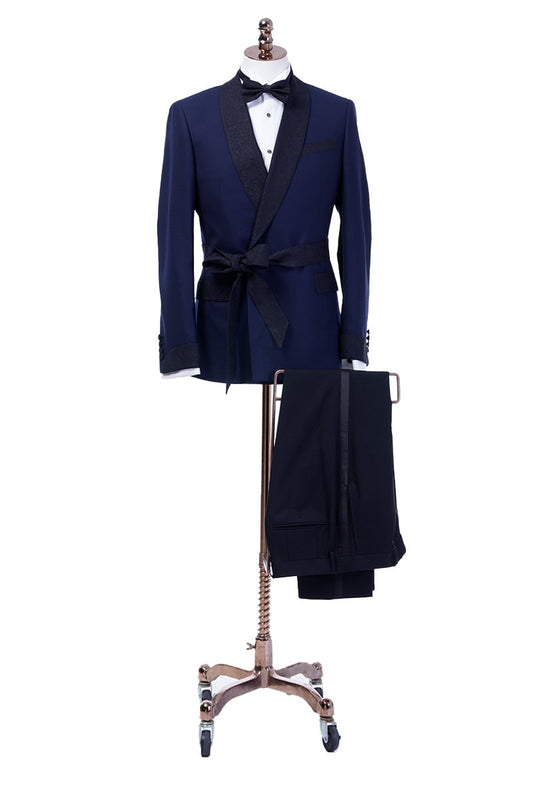 Navy double breasted tuxedo with black shawl satin lapel and black satin belt, black satin jacket cuffs and black satin trim on the pockets. Black trousers to compliment the black satin accents on the tuxedo jacket.