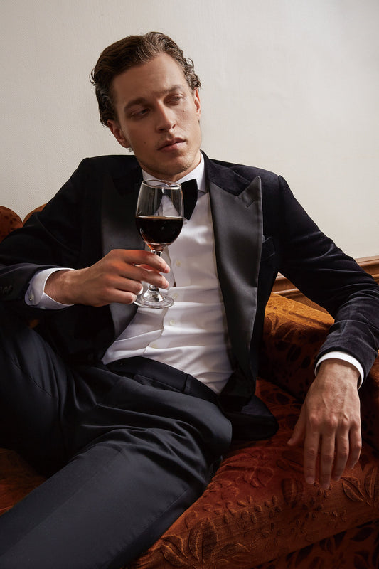 Black velvet wedding tuxedo. Black velvet tux with satin peak lapel and black trousers. Satin covered buttons and satin accents on the pockets on this black velvet formal wedding tuxedo. black velvet tux. formal wedding tuxedo. black tux for groom.