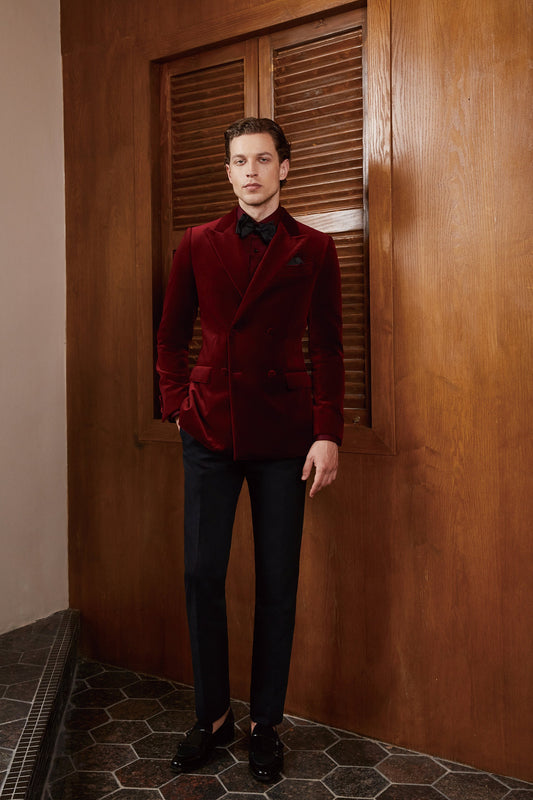 Red velvet tuxedo. Double breasted velvet tuxedo jacket with velvet covered buttons. Dark red maroon velvet tuxedo. Black pants with black satin accent stripe. Velvet wedding tuxedo. Velvet formal tuxedo.