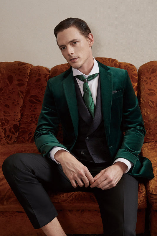 Green velvet tuxedo jacket. Notch lapel with slanted pockets. Black pants with satin accent. Formal green velvet tuxedo jacket. Velvet wedding tuxedo. Velvet smoking jacket. Green velvet tuxedo with satin covered buttons.