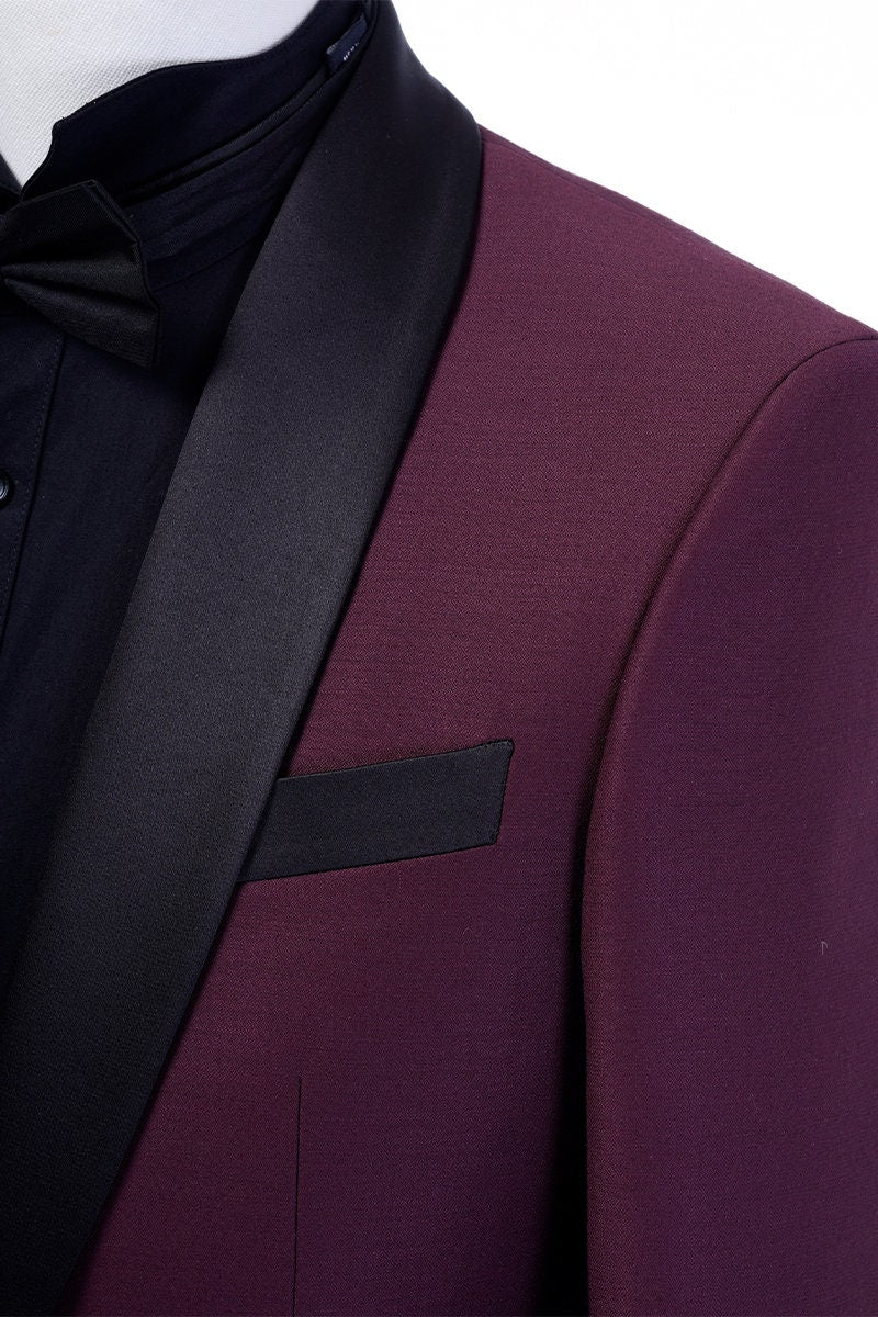 Burgundy tuxedo jacket with black satin shawl lapel. Burgundy vest and pants pictured. Burgundy wedding tuxedo. Groom burgundy suit. Maroon wedding tuxedo. Maroon tux. Burgundy wedding tuxedo. Maroon wedding tux. Formal burgundy tux.