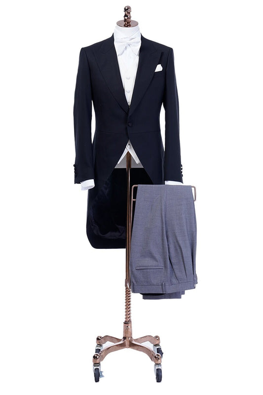 Black formal tail tuxedo. Black tuxedo with peak lapel. Comes with white vest. Fabric covered buttons and grey pants. Elegant and timeless tuxedo. Black tail tux. Wedding tuxedo. Black wool wedding tux with tail. Morning Coat Tuxedo.