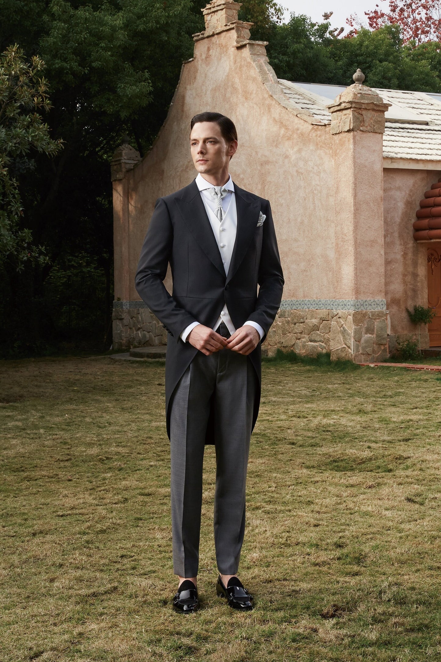 Black formal tail tuxedo. Black tuxedo with peak lapel. Comes with white vest. Fabric covered buttons and grey pants. Elegant and timeless tuxedo. Black tail tux. Wedding tuxedo. Black wool wedding tux with tail. Morning Coat Tuxedo.