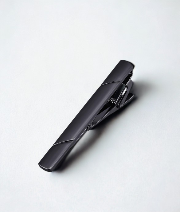 Black tie clip on a white background