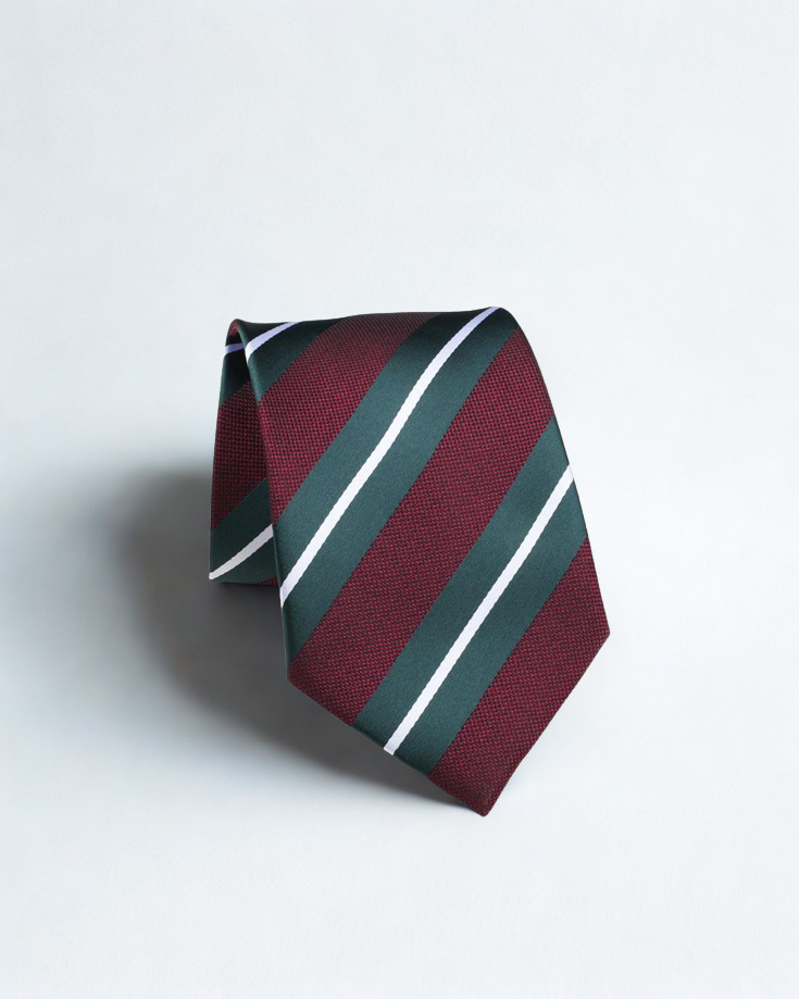Striped tie with red, green, and white pattern on a light gray background