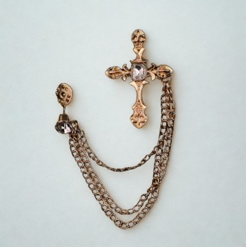 A brooch with cross pendant, and chain