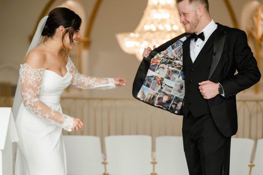 Man in a tuxedo showing the inner jacket display the custom suit lining contain photos with the woman, standing next to a woman in a wedding dress.