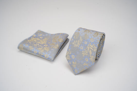 Gray tie with gold floral pattern on a white background