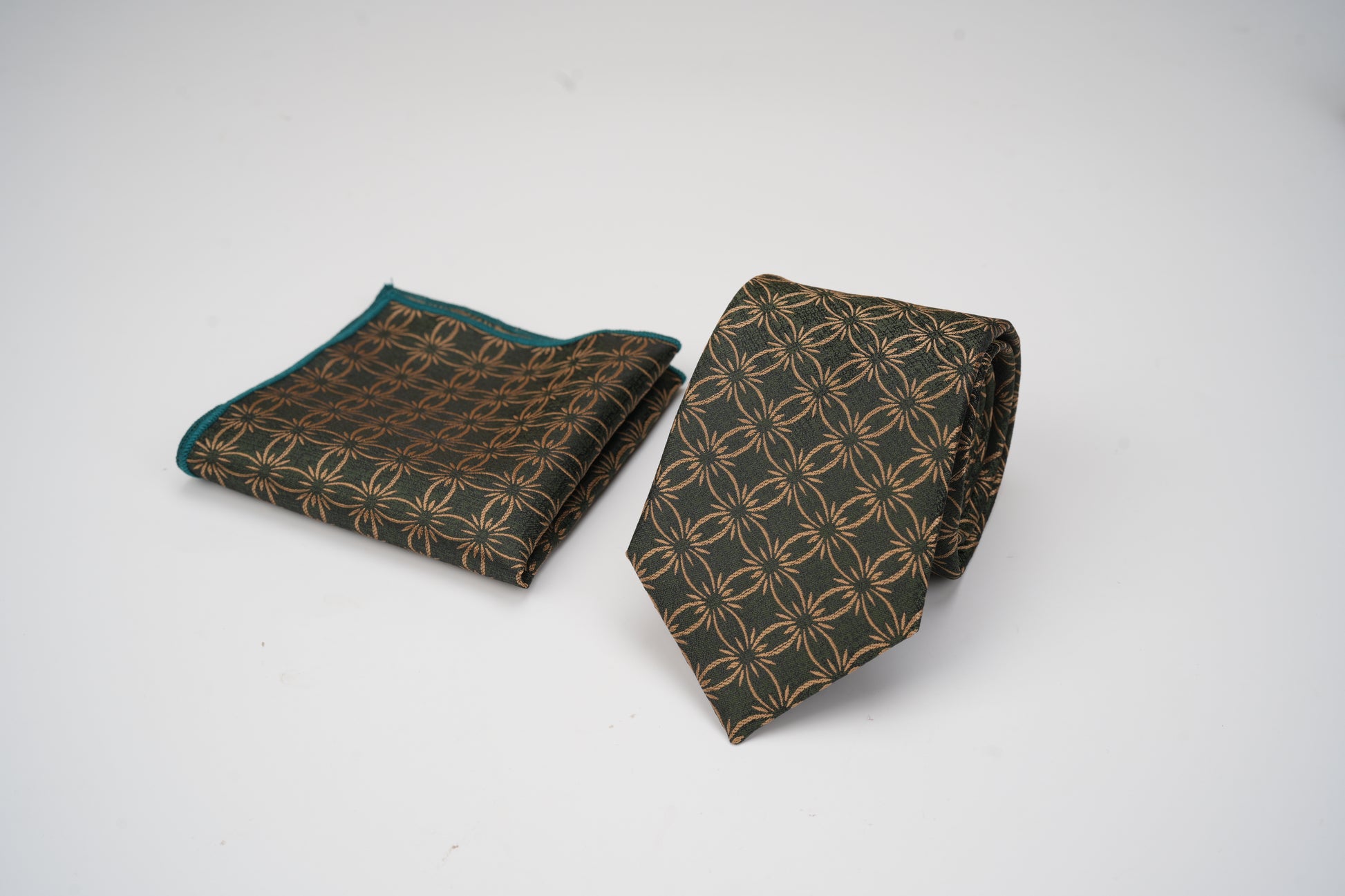 Patterned tie and pocket square on a white background