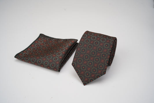 Patterned tie and pocket square set on a white background