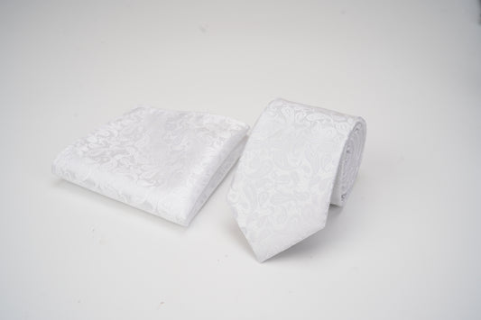 Two white pillows with textured surface on a light gray background