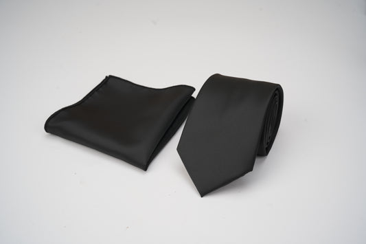 Black tie and black pocket square on a white background