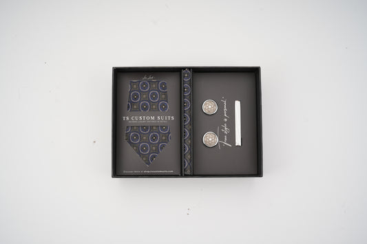 Cufflinks in a branded box on a white background