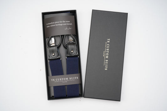 Navy suspenders in a 'TS Custom Suits' branded box on a white background