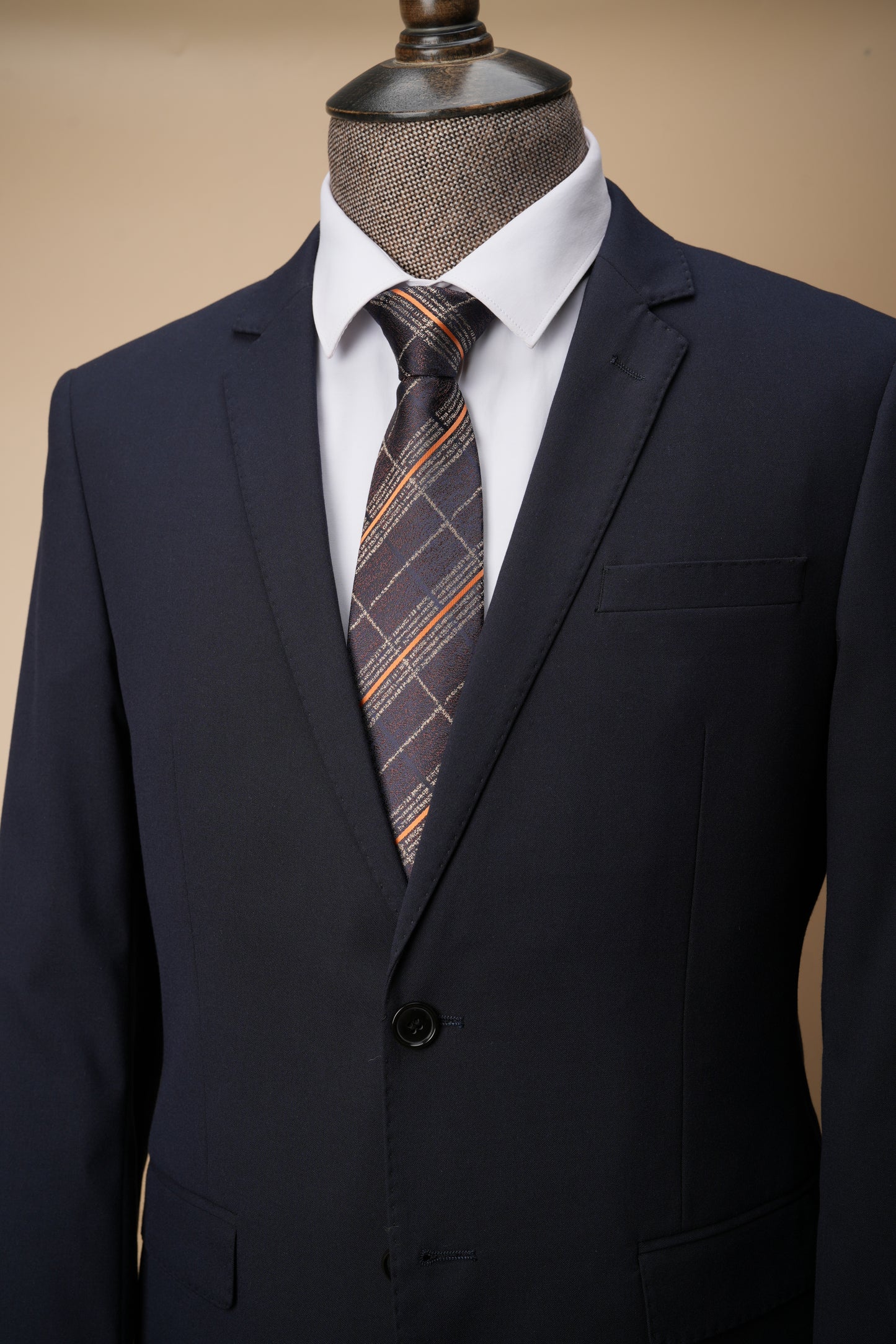 Brown tie on suit
