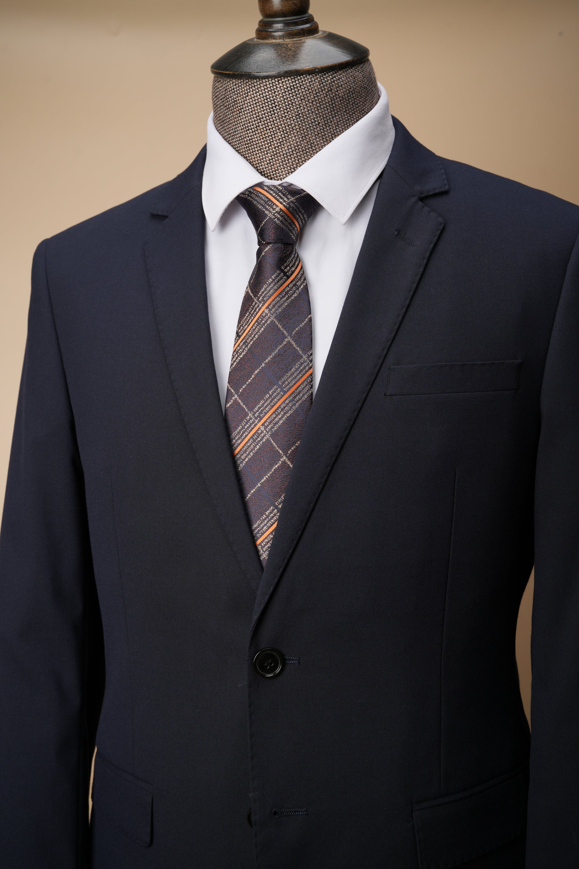 Brown tie on suit