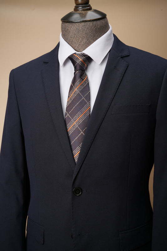 Brown tie on suit