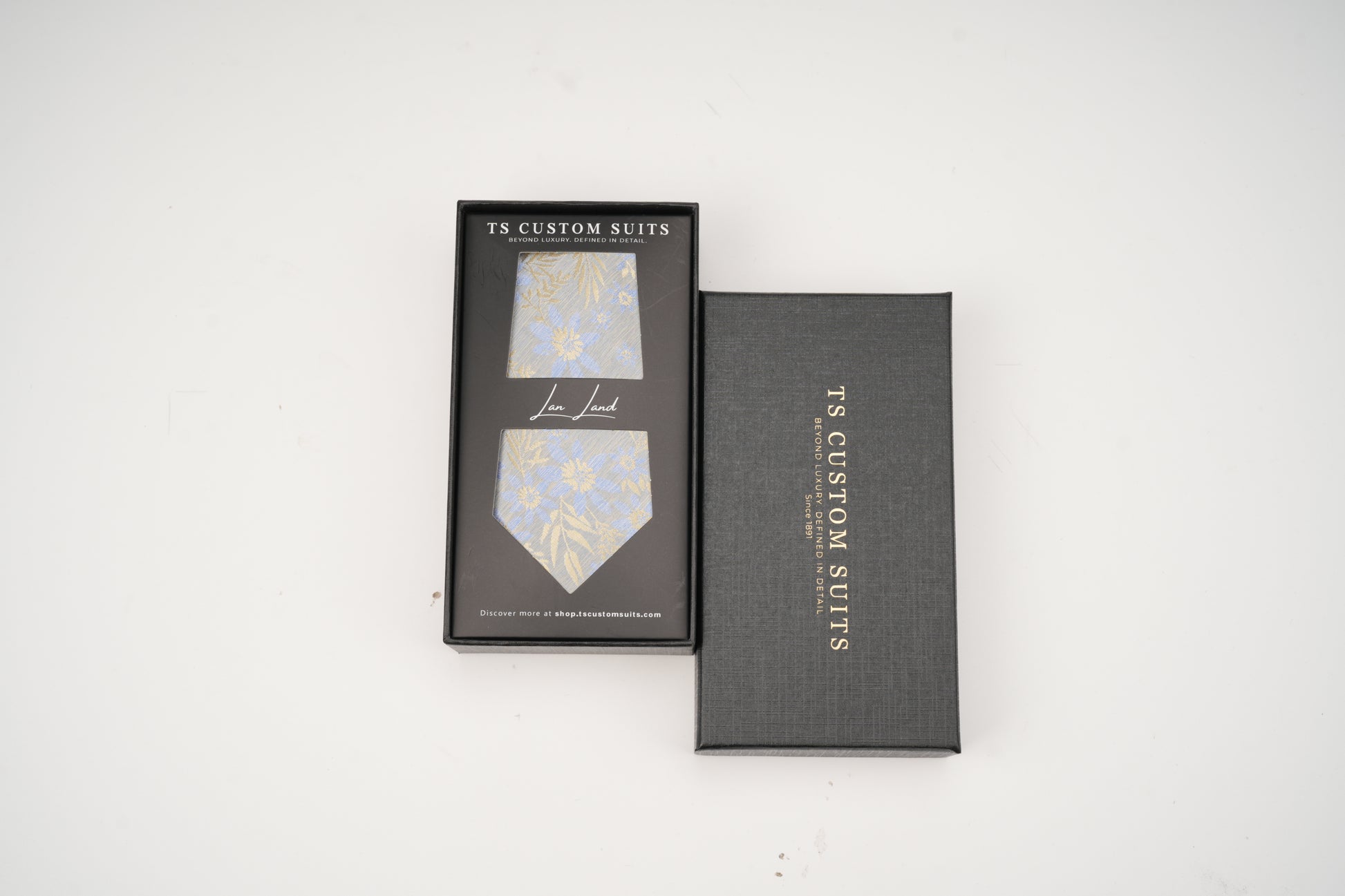 TS Custom Suits tie and box on a white background