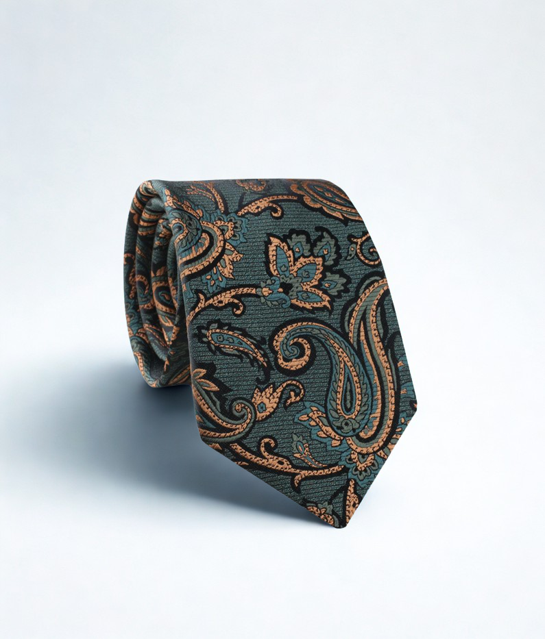 Patterned emeral tie with painsley on a light gray background.