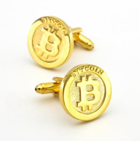 Gold Bitcoin-themed cufflinks on a white background