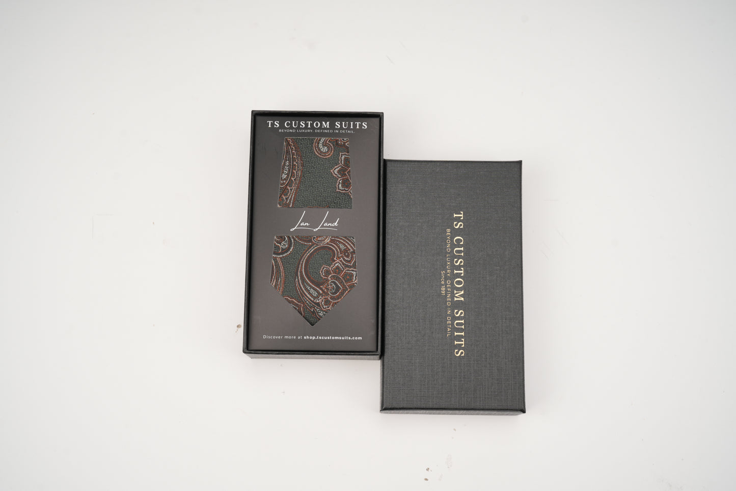 Green tie in the box with 'TS Custom Slits' branding on a white background