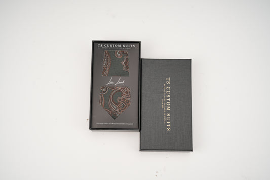Green tie in the box with 'TS Custom Slits' branding on a white background