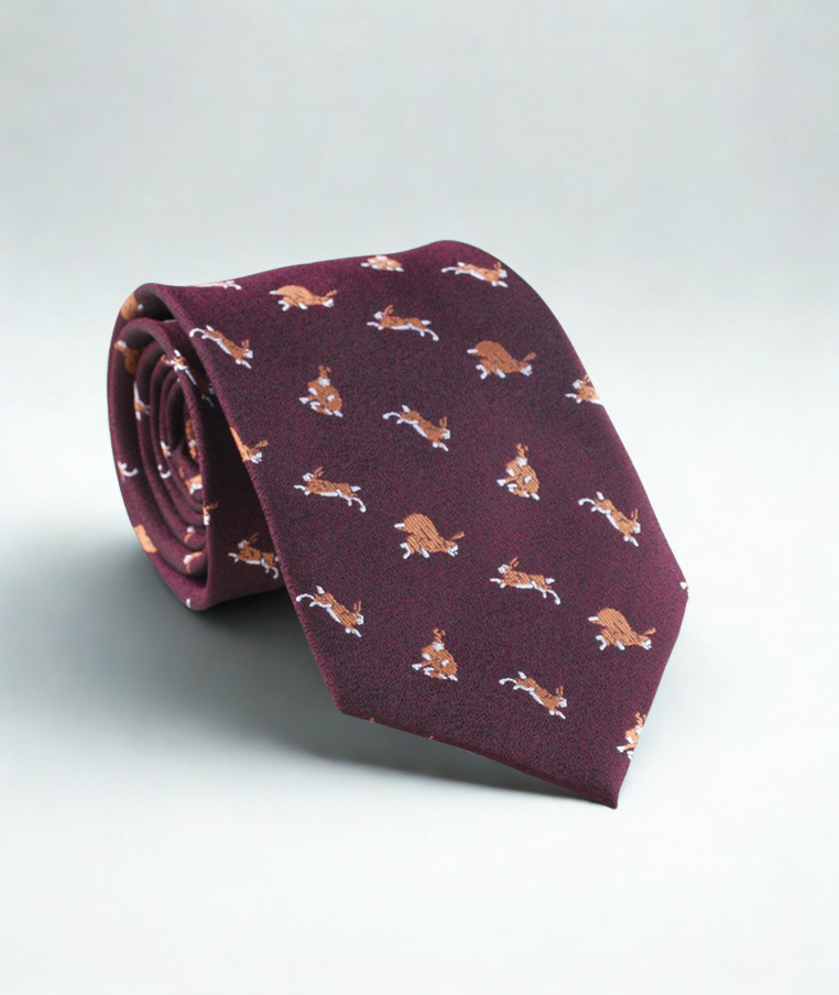 Maroon tie with rabbit/bunny pattern on a light gray background