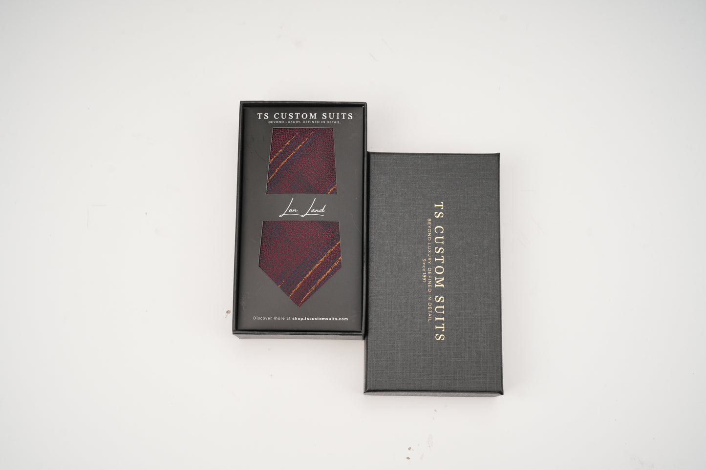 Two gray boxes with 'TC Custom Suits' branding on a white background
