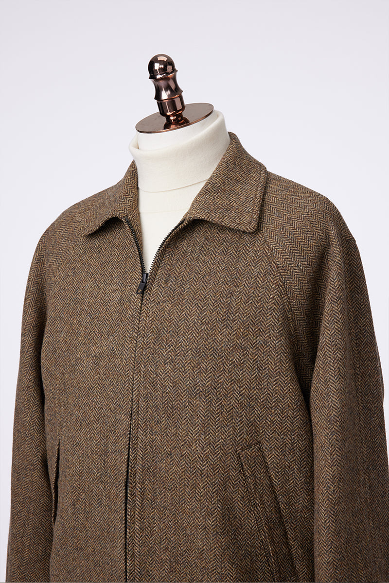 Brown coat on a mannequin against a white background