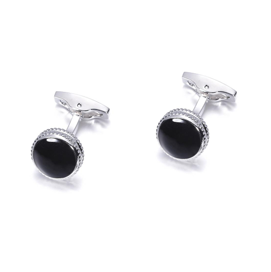 Pair of silver cufflinks with black stones on a white background