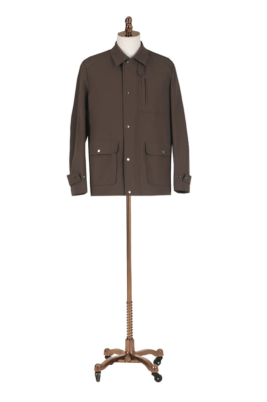 Brown jacket on a mannequin against a white background