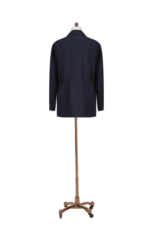 Navy blue coat on a mannequin with a decorative base against a white background