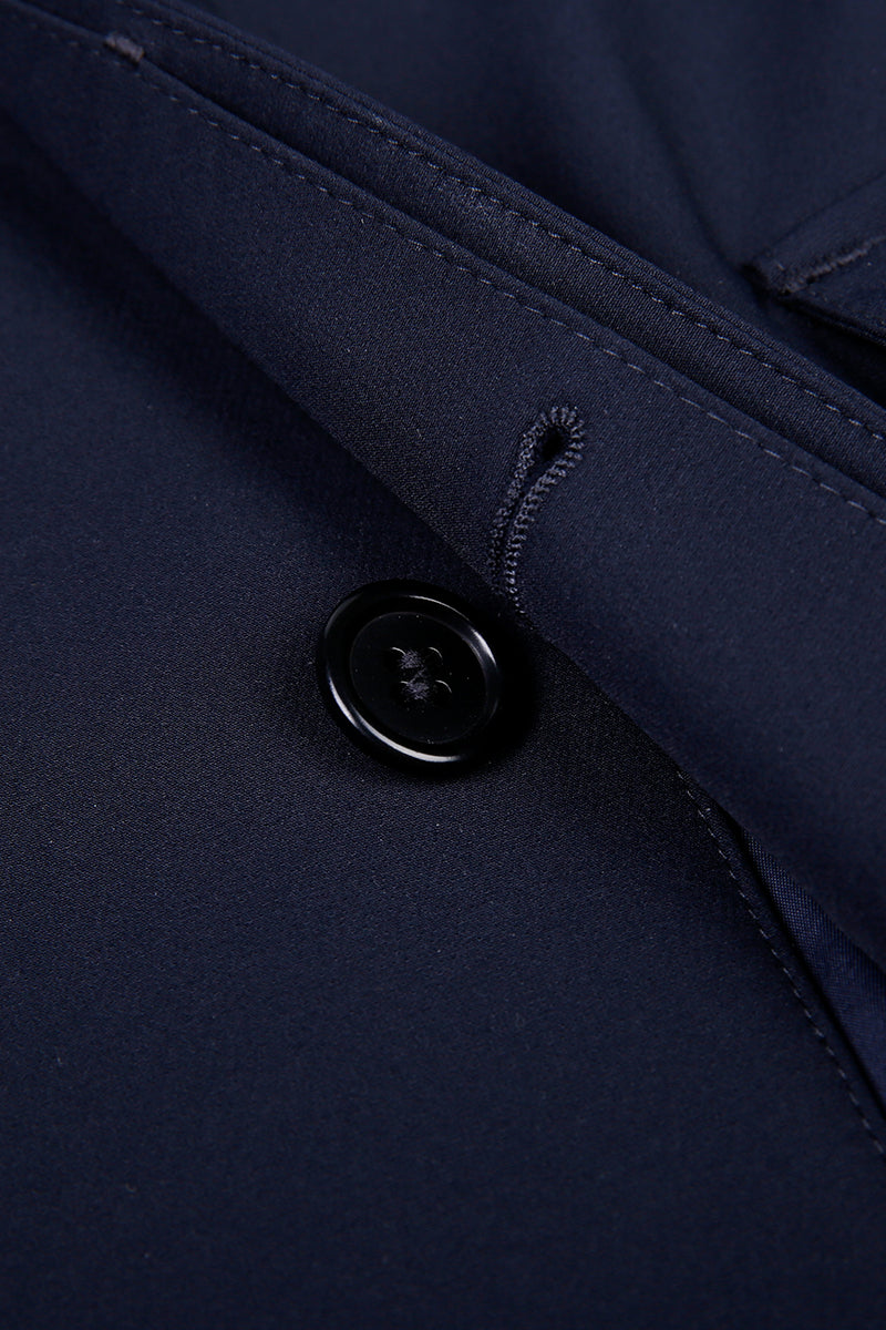 Close-up of a button on a dark blue jacket