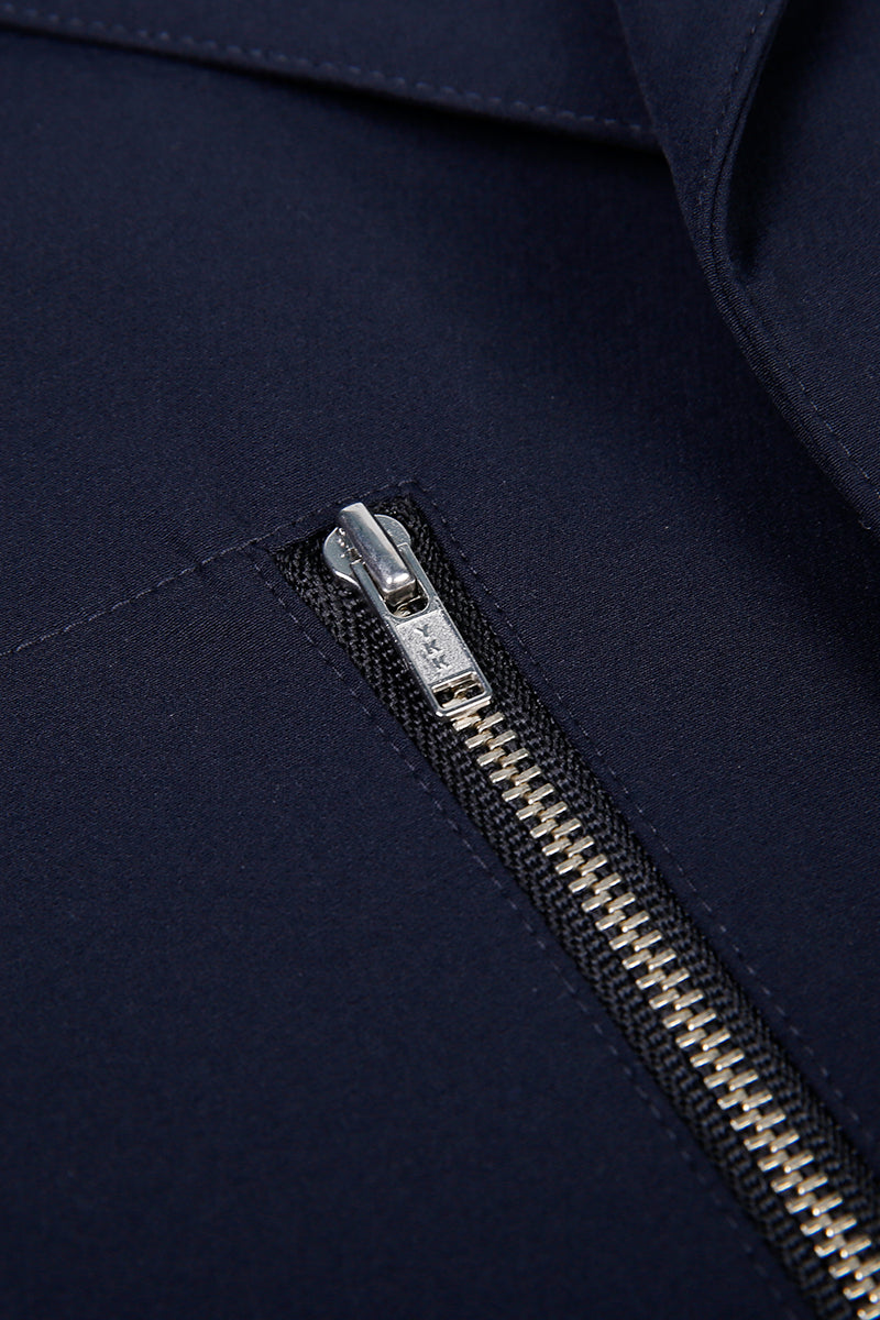 Close-up of a zipper on a dark blue jacket