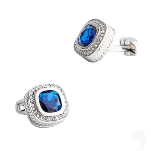 Pair of silver cufflinks with blue gemstones on a white background