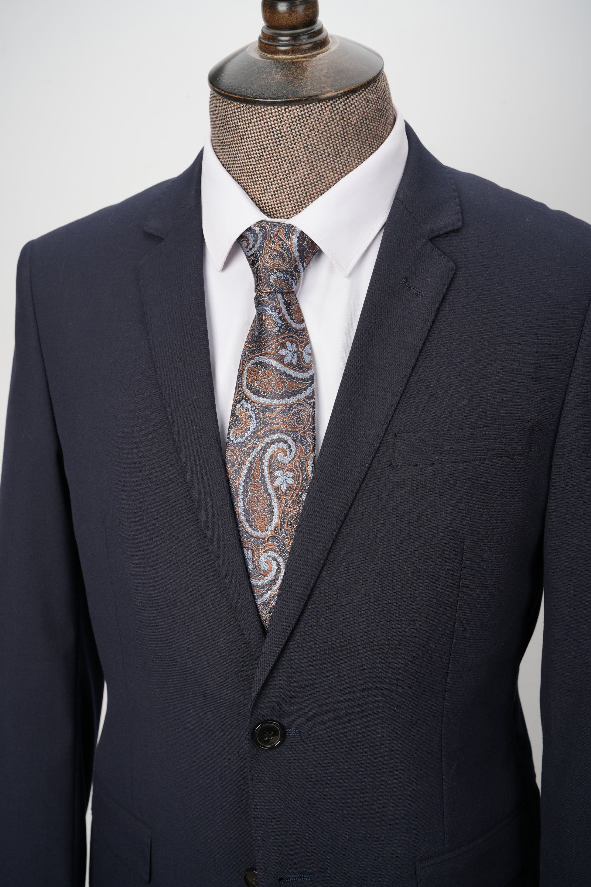 brown paisley tie with black suit