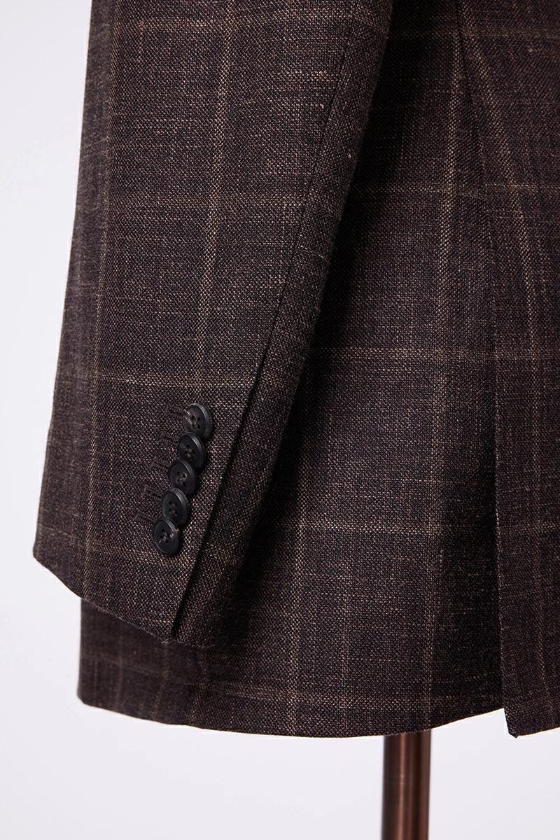 Brown checkered suit jacket on a white background