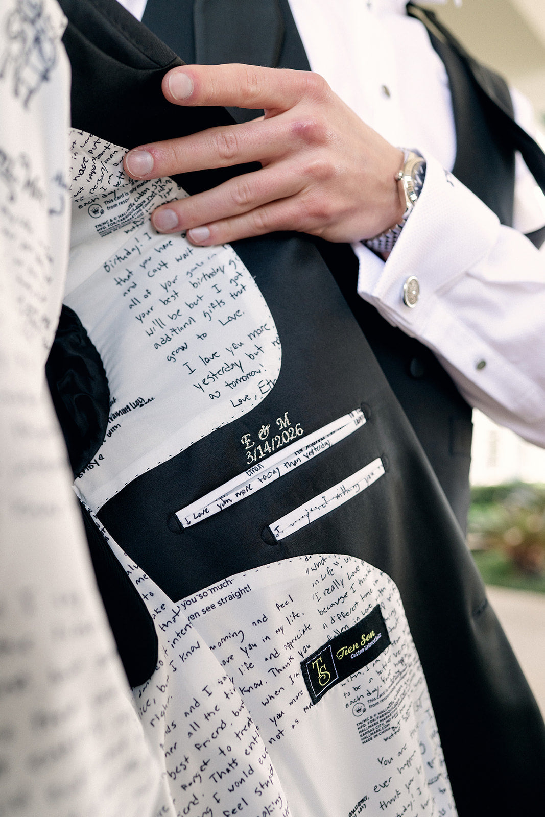 Close-up of a suit with text and branding details