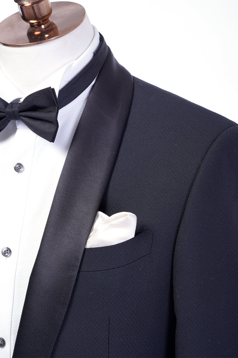 Midnight blue navy tuxedo with black satin shawl lapel. navy blue tuxedo pants with black satin stripe. Black satin covered buttons on this midnight blue dark navy blue tuxedo. Formal wedding tuxedo. Formal wedding tux. Elegant tuxedo.