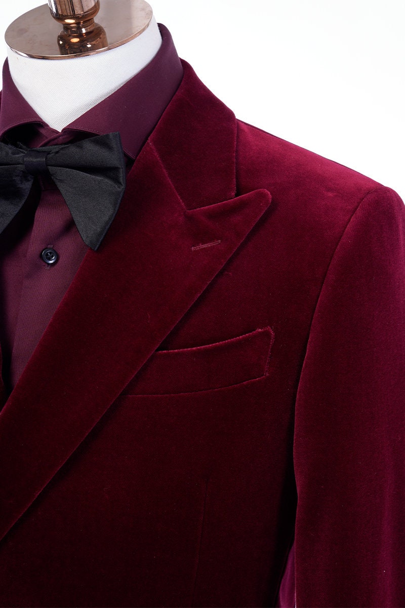 Red velvet tuxedo. Double breasted velvet tuxedo jacket with velvet covered buttons. Dark red maroon velvet tuxedo. Black pants with black satin accent stripe. Velvet wedding tuxedo. Velvet formal tuxedo.