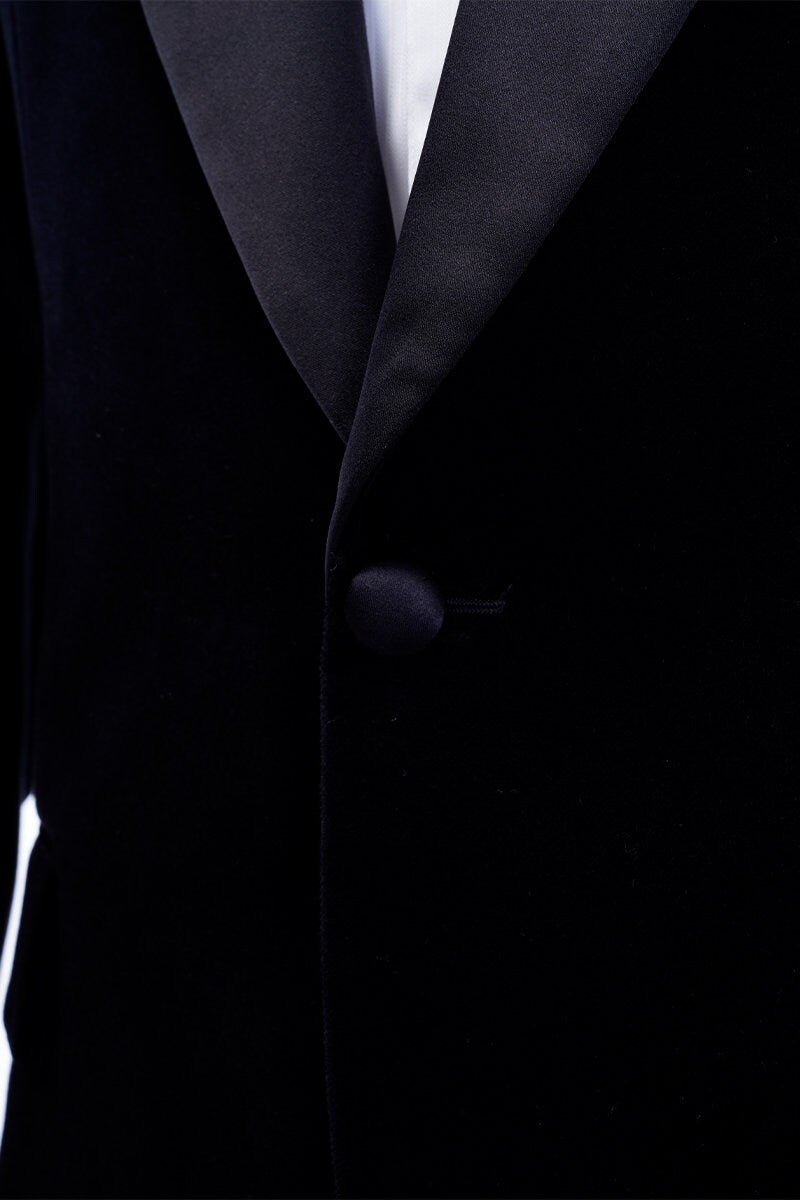 Black velvet wedding tuxedo. Black velvet tux with satin peak lapel and black trousers. Satin covered buttons and satin accents on the pockets on this black velvet formal wedding tuxedo. black velvet tux. formal wedding tuxedo. black tux for groom.