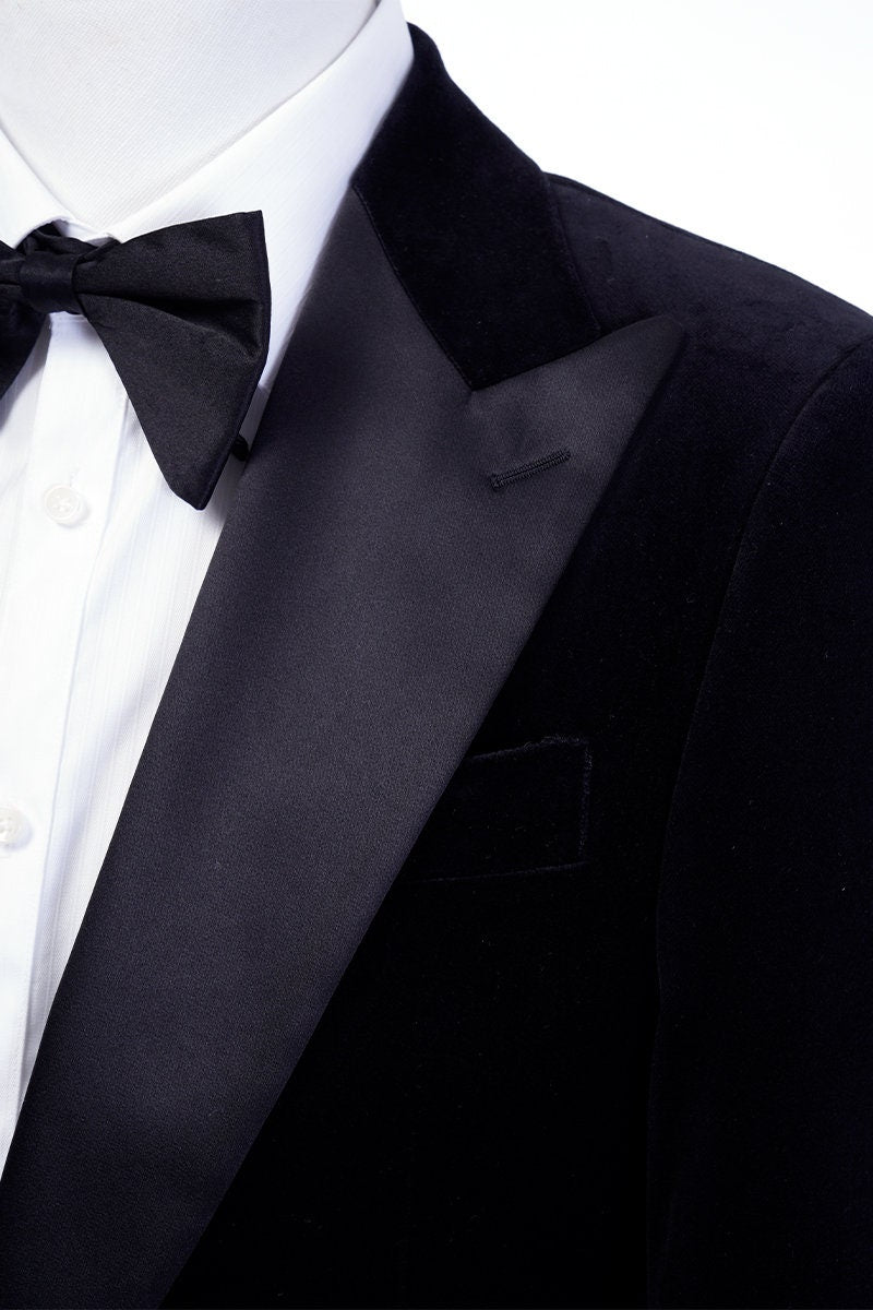 Black velvet wedding tuxedo. Black velvet tux with satin peak lapel and black trousers. Satin covered buttons and satin accents on the pockets on this black velvet formal wedding tuxedo. black velvet tux. formal wedding tuxedo. black tux for groom.